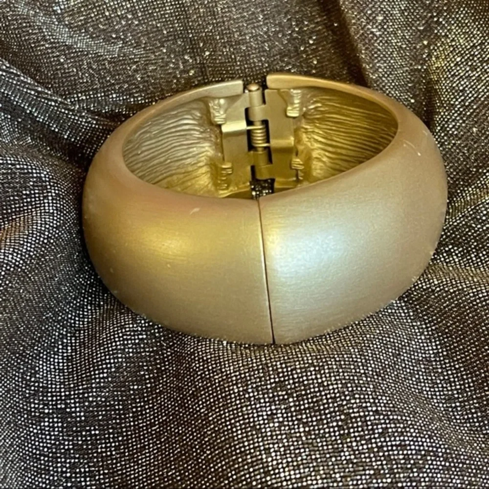 Kenneth Jay Lane satin gold bangle hinged domed